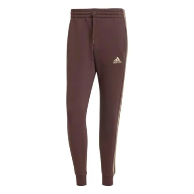 Image of adidas Men&#039;s Essentials Fleece 3 Stripes Tapered Cuff Pants, Shadow Brown, XXL